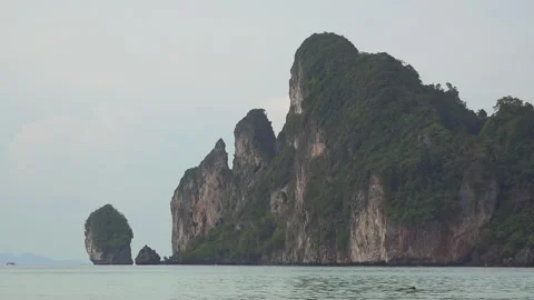 High steep cliffs out of the waters of Andaman Sea in Thailand Stock Footage 290457055