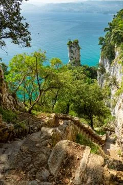 High steps down to El Caballo lighthouse in Cantabria Stock Photos