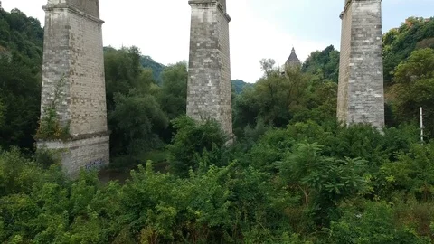 High stone bridge over the gorge Stock Footage 114082359