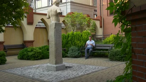 High Stone Statue is in a Centre of a Green Zone Stock Footage 67537686