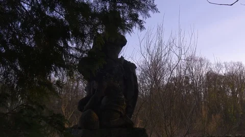 High Stone Statue on a Small Fence Stock Footage 73663970