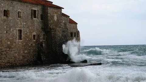 High stormy waves at the ancient castle in Budva, Montenegro Stock Footage 96905643