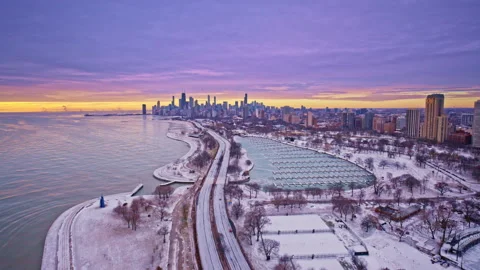 High sweeping sunrise drone shot over downtown Chicago with lake and skyline. Stock Footage 331235615