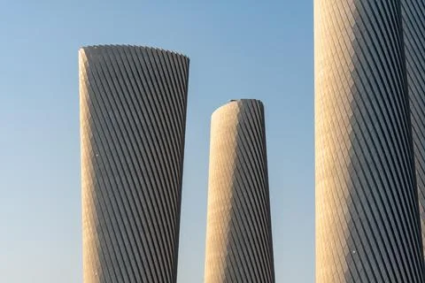 High-tech architecture of the twisted Lusail Plaza Towers in Lusail City. Stock Photos