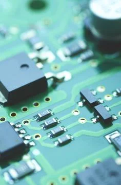 High-tech board with electronic components and microchips close-up Stock Photos