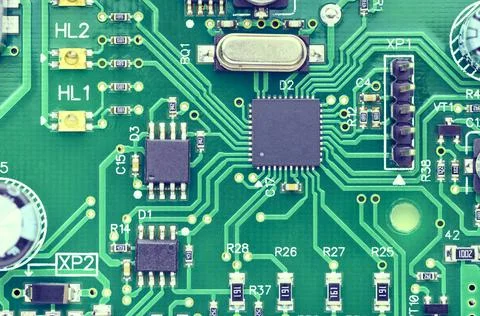 High-tech board with electronic components and microchips Stock Photos