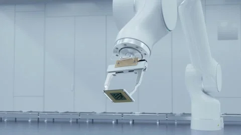 A high-tech brandless robotic arm manipulator arm, holds processor. Video stock 259802542