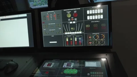 High-tech control panels and touch screens of a ship bridge simulator Stock Footage 313649222