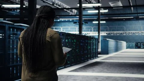High tech data center technician uses tablet to develop disaster recovery plans Stock Photos