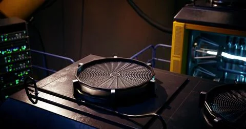 High tech device on futuristic work surface with equipment in background 스톡 일러스트