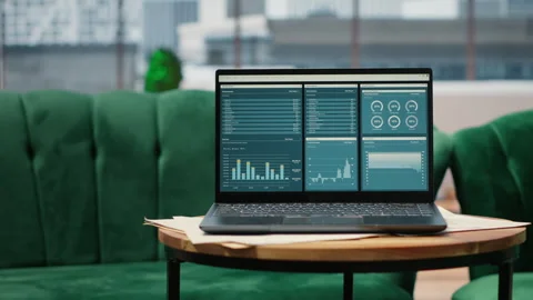 High tech device showcasing infographics and business data in empty office Stock Footage 317353639