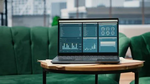 High tech device showcasing infographics and business data in empty office Stock Photos