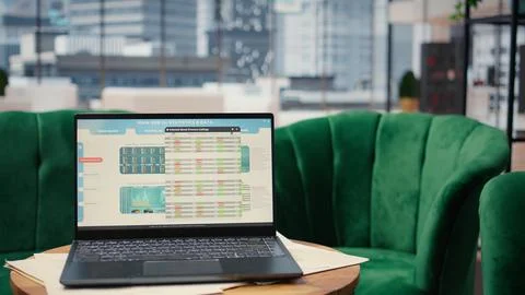 High tech device showcasing infographics and business data in empty office Stock Photos