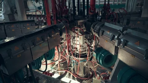 High-tech equipment at the enterprise. Melting plastic. Rotating elements. Stock Footage 71338592