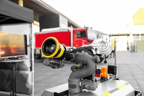 High-tech firefighting robot with a hose for extinguishing fires Stock Photos