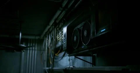 High tech gaming rig in a dimly lit workspace with cables and ventilation Stock Illustration