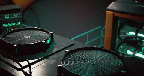 High tech gaming setup featuring illuminated cooling fans and equipment Stock Footage 303849366