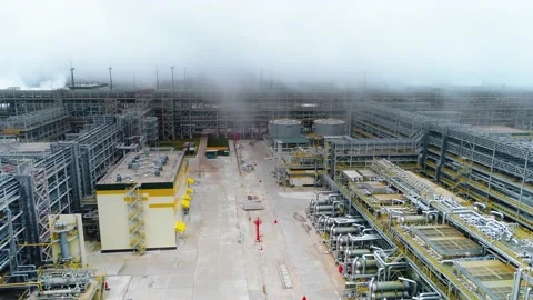 High-tech gasoline and fuel plant with pipelines on foggy day. Drone footage. Stock Footage 155283346