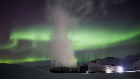 High tech geothermal steam power generator bright aurora borealis Iceland 4k Stock Footage 73367028