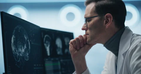 High tech Laboratory Scientist looks at Brain Scan Stock Footage 295316494