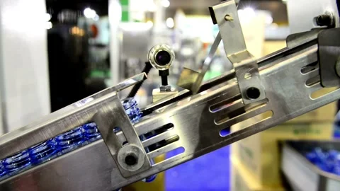High Tech Manufacturing Facility Molding numerous Raw plastic bottles. for Video stock 334588019