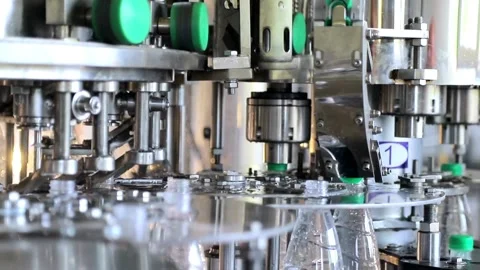 High Tech Manufacturing Facility Molding numerous Raw plastic bottles. for Video stock 334588050