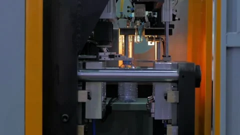 High Tech Manufacturing Facility Molding numerous Raw plastic bottles. for Video stock 334588053