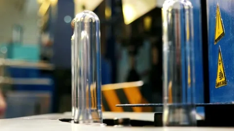 High Tech Manufacturing Facility Molding numerous Raw plastic bottles. for Video stock 334588330
