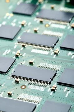 High-tech microchips on an electronic board close-up Stock Photos