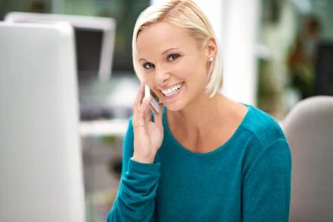 High-tech phone for a high flyer. Portrait of a young businesswoman holding a Stock Photos