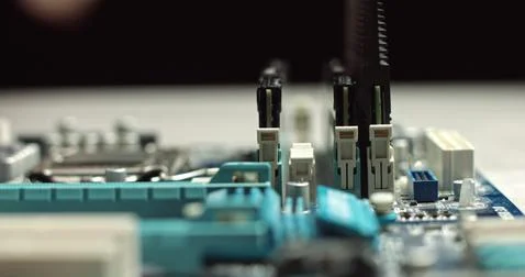 High tech. The process of installing RAM on a computer motherboard. Close-up 4K Stock Photos