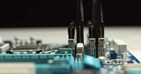 High tech. The process of installing RAM on a computer motherboard. Close-up 4K Stock Photos
