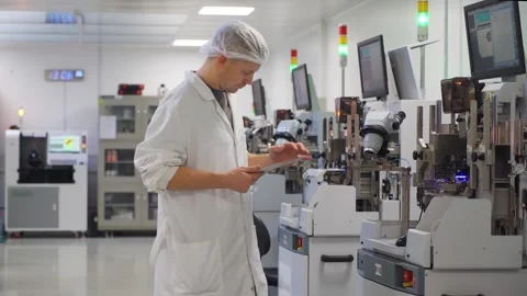 High-tech production of semiconductor chips for microelectronics. Employee walks Video stock 318166112