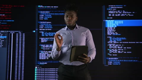 High-tech startup concept: An innovative male software engineer stands Stock Footage 243901325