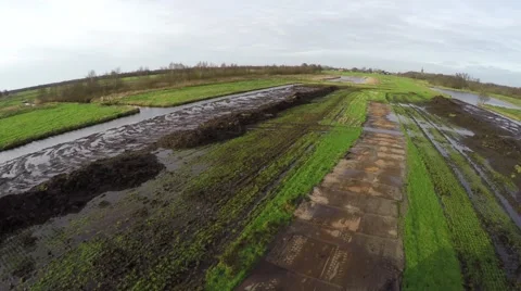 High tech stunt drone flying backwards low over an excavator arm 4k Stock Footage 58778612