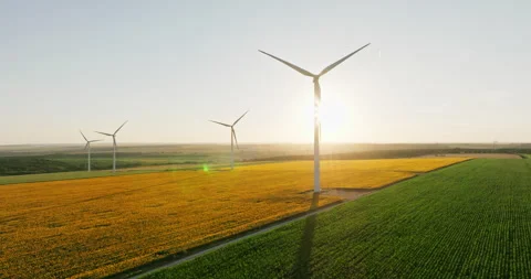 High-tech wind turbines generate clean energy over rural fields Stock Footage 301893346