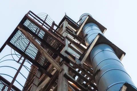 High technical structure with a pipe against the blue sky Foto stock