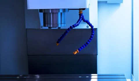 High technology machines ,CNC machine while cutting small hole on workpiece Stock Photos