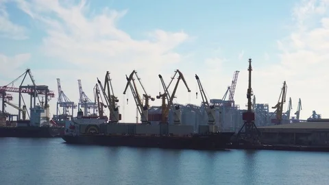 High technology mechanical cranes working with huge container ships unloading Stock-Footage 98408461