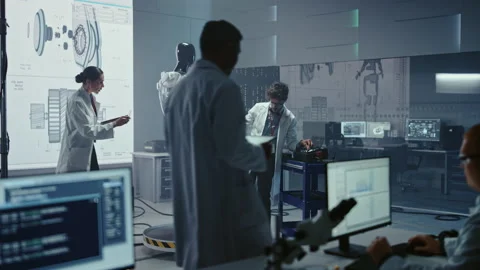 High Technology Research Laboratory Scientists and Engineers Testing Exoskelet Stock Footage 136593700