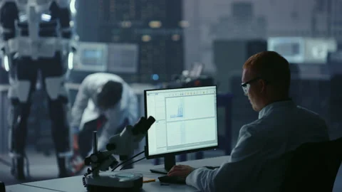 High Technology Research Laboratory Scientists and Engineers Testing Exoskelet Stock Footage 136593770