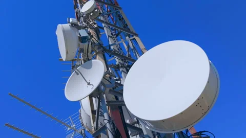 High telecommunication tower standing on top of a mountain against the blue sky  Stock Footage 104065917