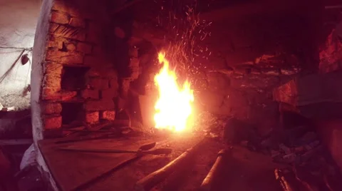 High temperature bright sparkling little flame, hand and blacksmith tools Stock Footage 46420248