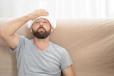 High temperature concept. Man feels badly ill. How to bring fever down. Cold  Stock Photos