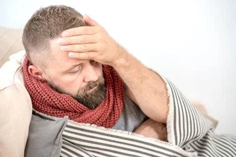 High temperature concept. Man feels badly ill. How to bring fever down. Cold  Stock Photos