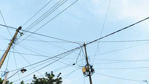 High tension electrical pole structure captured in daylight with clear blue.. Stock Photos