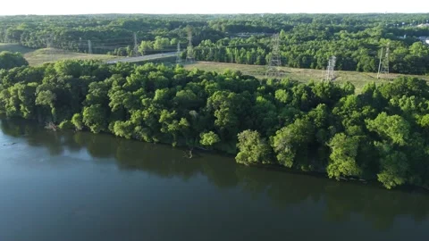 High tension power lines run in a corridor parallel to the Catawba River Stock Footage 194537643