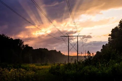 High tension wires dramatic sky Stock Photos
