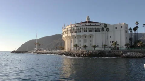 High tide allows large waves to surge over the rock barrier in Avalon Harbor Video stock 67970926