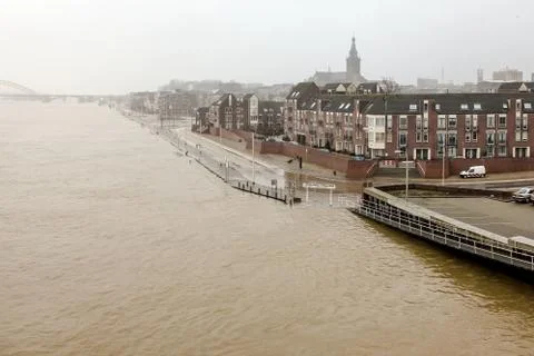 High tide of the river Waal flooding streets 写真素材